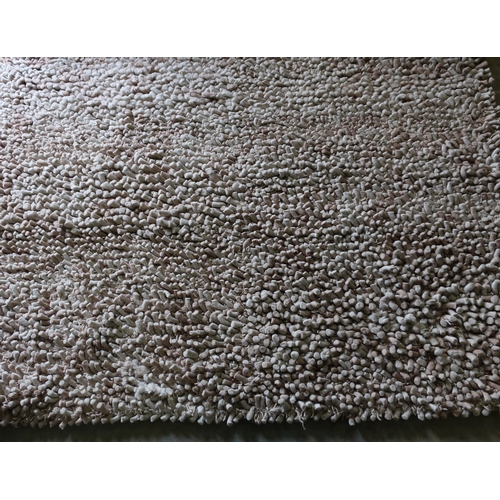 198 - Tufted beige ground wool rug (221cm x 156cm)