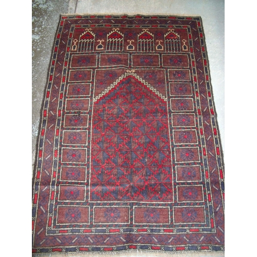 205 - Brown and red Old Baluchi rug (131cm x 90cm)