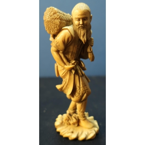 21 - Late 19th C Chinese carved ivory figure of an eldery figure carrying wicker basket upon his shoulder... 
