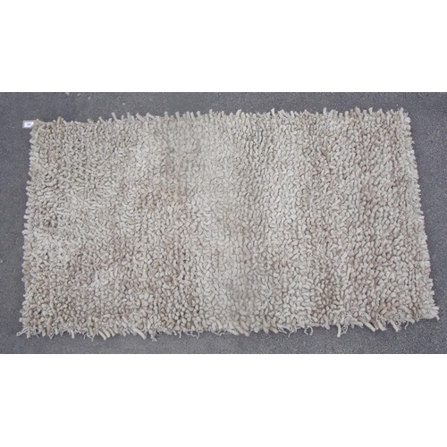 192 - Tufted beige ground wool rug (150cm x 82cm)