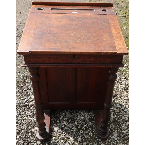 264 - Late Victorian stained pine schoolmaster's desk with lift up top, turned columns and cupboard (67cm ... 