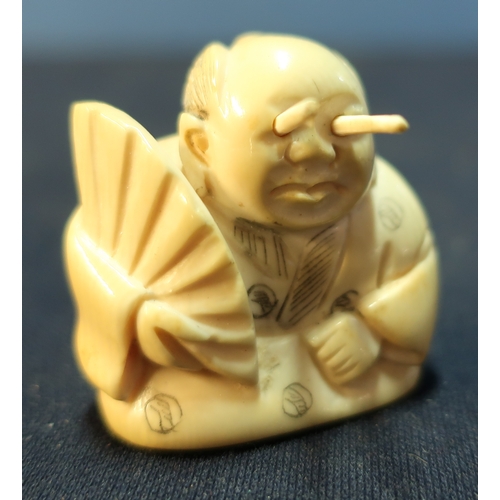 34 - Edo period Japanese Nutsuke of an oriental gentleman with protracting eyes, signed to the base (appr... 