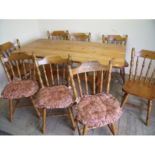 215 - Pine rectangular refectory type table and a set of eight dining chairs
