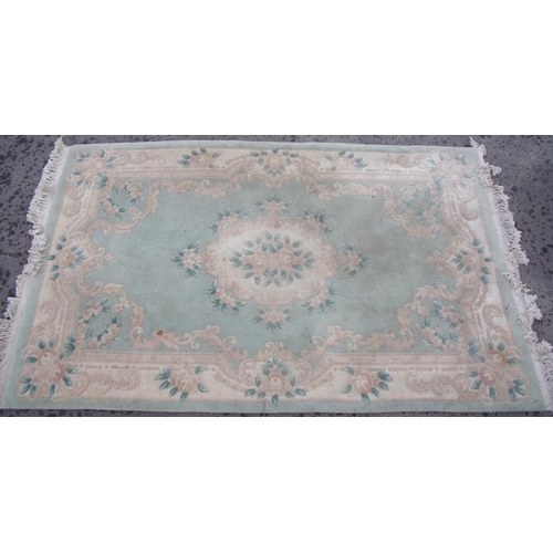 390 - Traditional Chinese embossed washed woollen rug, green ground with central floral medallion and flor... 