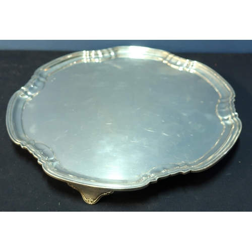 334 - A large Sheffield 1930 silver hallmarked salver on 3 raised supports, with stepped edge border (diam... 