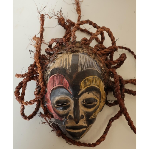 511 - African tribal carved wood mask with hessian stringwork hair