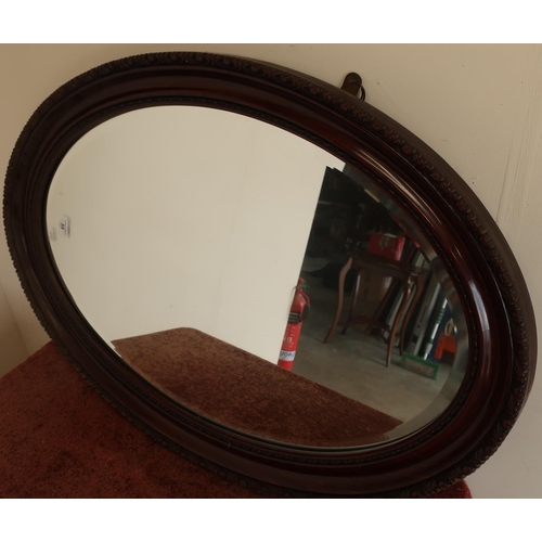 35 - 19th/20th C oval mahogany framed bevelled edge wall mirror
