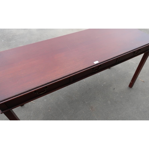 482 - Georgian style mahogany finish side table with three frieze drawers (151cm x 55cm x 76cm)