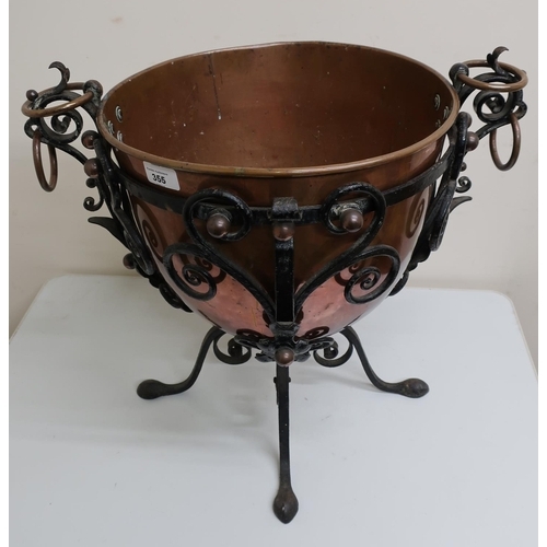 531 - Unusual early 20th C copper jardinière in wrought metal frame (height 45cm)