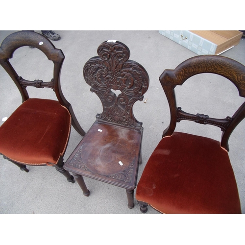 539 - 19th C carved oak hall chair on turned supports with solid seat, and two Victorian dining chairs (3)