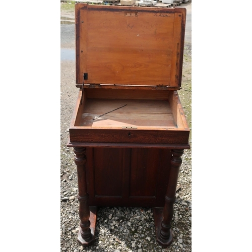 547 - Late Victorian stained pine schoolmaster's desk with lift up top, turned columns and cupboard (67cm ... 