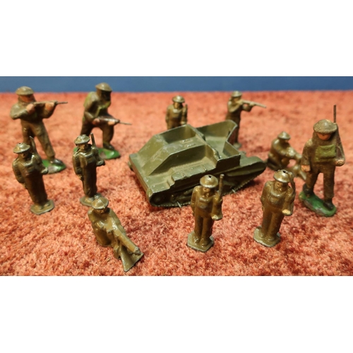 110 - Early Britains armoured vehicle and a selection of cast metal British soldiers