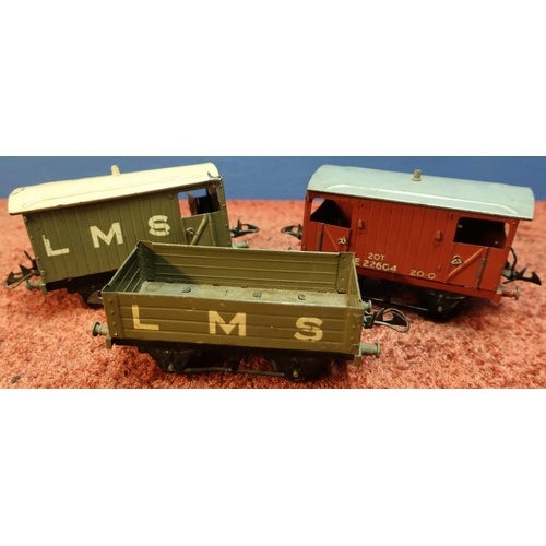 205 - Three Hornby tin-plate O gauge wagons including LMS box wagon, LMS breakstyle van and another simila... 