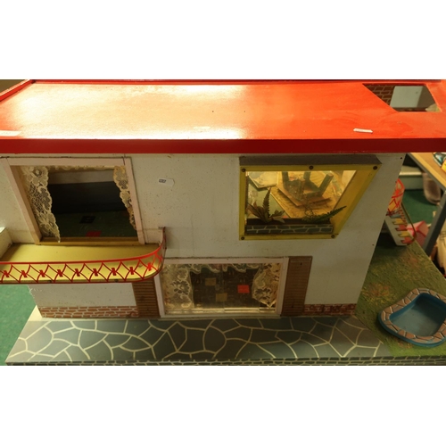 232 - Circa 1960s wooden constructed chalet style dolls house with various accessories