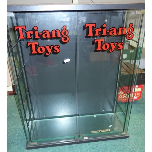 95 - Glazed two door model display cabinet, the doors with transfer print for Tri-ang Toys (61cm x 25cm x... 