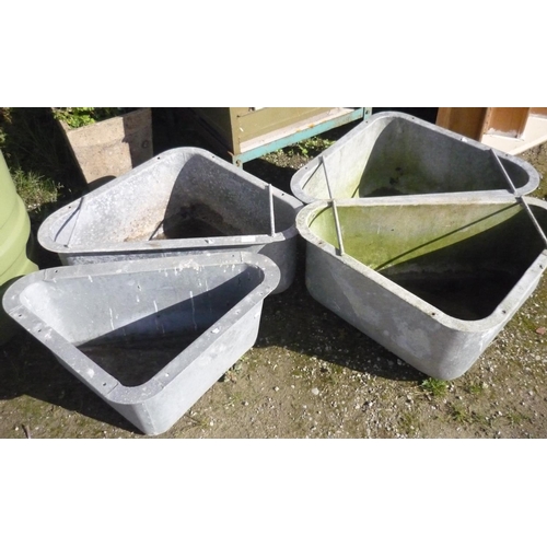 155 - Four triangular galvanised feed troughs