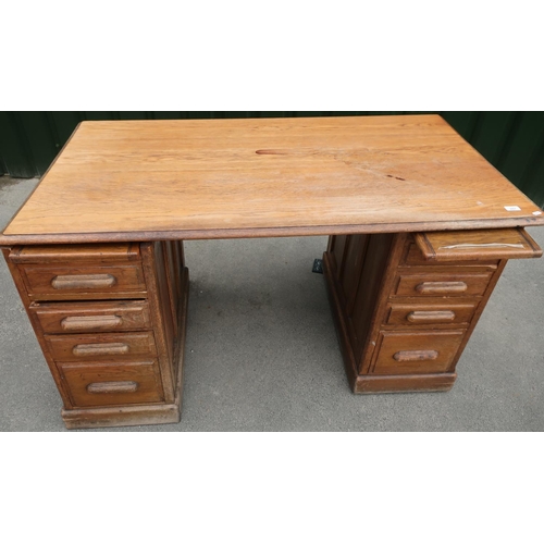 234 - Edwardian oak twin pedestal desk with four drawers to each pedestal and panel detail (77cm x 140cm)