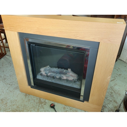 245 - Modern light oak framed electric plug in fire (width 103cm)