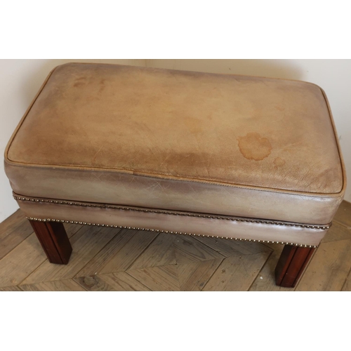 289 - Quality rectangular tan leather footstool with brass studded detail on square mahogany supports (67c... 