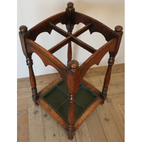 296 - Edwardian oak four sectional stick stand with turned supports and lift out tray