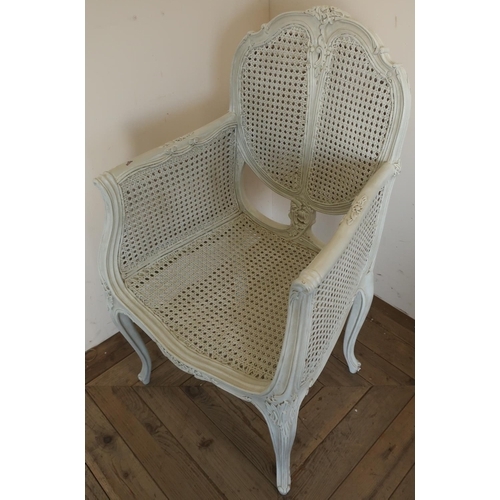 282 - French style cream painted carved wood and rattan armchair with double canework panels to the seat b... 