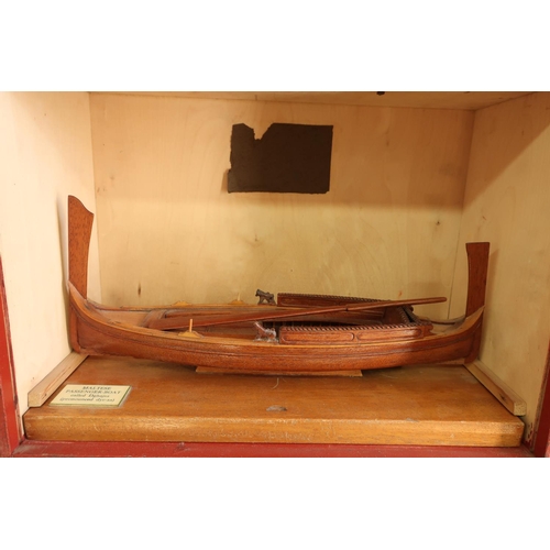 106 - Cased scale model of a Maltese passenger boat (Dghajsa), gondola style model (overall length 38cm)