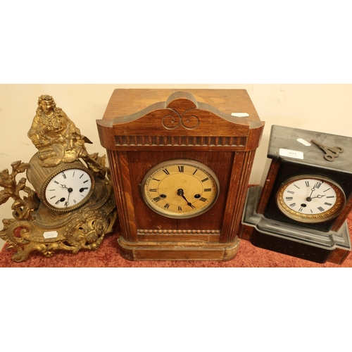 304 - Victorian black slate mantel clock, a French style gilt cased mountain clock, and an oak mantel cloc... 