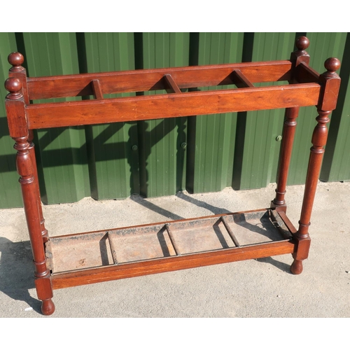 320 - Mahogany rectangular four sectional stick stand with metal lift out tray and turned supports (91cm x... 