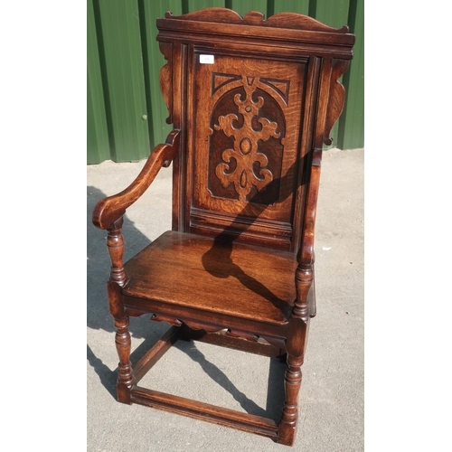 326 - Oak wainscot style chair with carved and paneled back, solid seat and turned supports