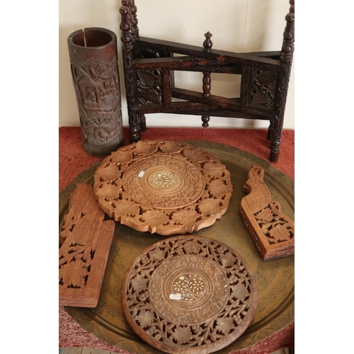 303 - Oriental bamboo brush pot, an Indian carved hardwood folding table and a brass top Benares table