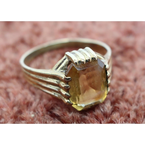 445 - 9ct gold dress ring set with large faceted stone