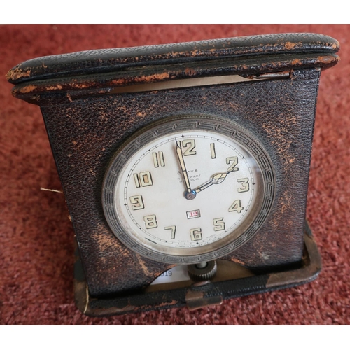 451 - Leather cased travelling eight day clock by R Stewart, Glasgow with date dial