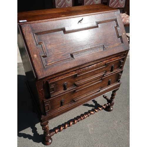 540 - Interwar oak Jacobean style bureau, panelled front opening to reveal partially fitted interior on ba... 