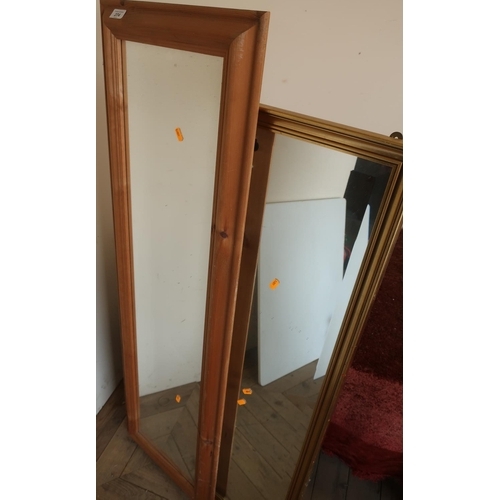 76 - Rectangular pine framed wall mirror and a gilt framed bevelled edge rectangular wall mirror (2)