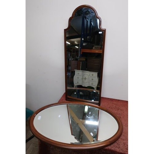 530 - Mahogany inlaid oval bevelled edge wall mirror and another mahogany framed mirror (2)