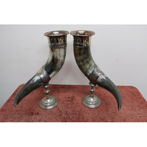 3 - A pair of elaborate WMF silver plated mounted cows drinking horn on turned circular base, bases mark... 