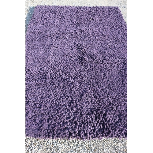 575 - Extremely large purple woolen rug by Hugh