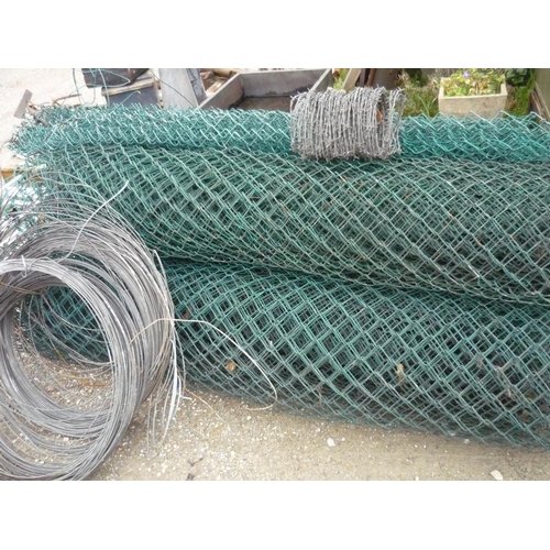 165 - Large quantity of plastic covered netting in three rolls, a small roll of barbed wire and three reel... 