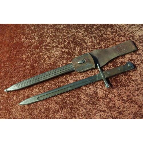 105 - Unusual bayonet marked T, with straight single fullered blackened blade marked TERNI, the crosspiece... 