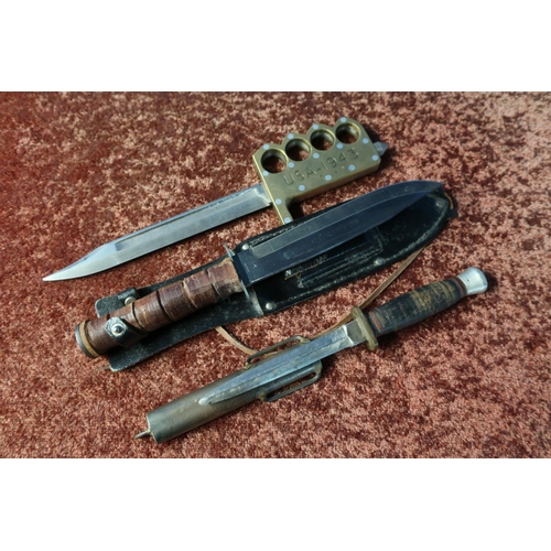 107 - WITHDRAWN: Unusual sheath knife with barrel handle, a combat knife and a made up knuckle duster knif... 