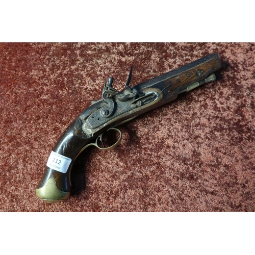 112 - Flintlock pistol with traces of proof marks to the 7 inch barrel, with brass mounts (A/F)