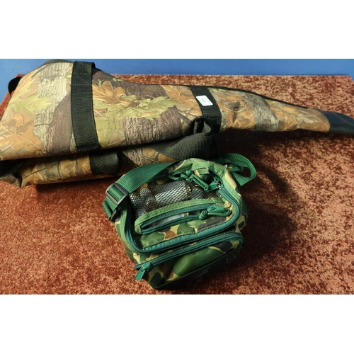 694 - Wooden camouflage gun slip and cartridge bag with a quantity of Express 12 bore shotgun cartridges (... 