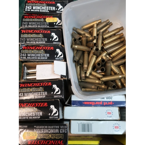 711 - Large selection of .308 & 7.62 casings and 9 boxes of .243 Winchester casings, box of 5.56 brass cas... 