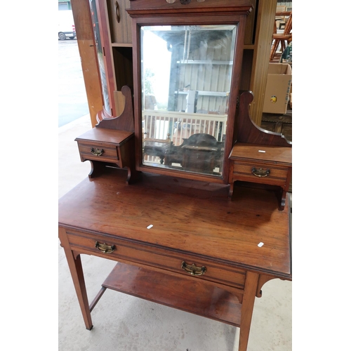 112 - Edwardian walnut dressing table with raised mirror back with two short drawers, above single drawer ... 