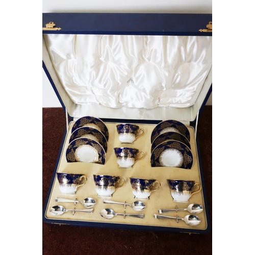 12 - Cased six place Coalport blue & gilt cup and saucer set with a set of silver plated teaspoons
