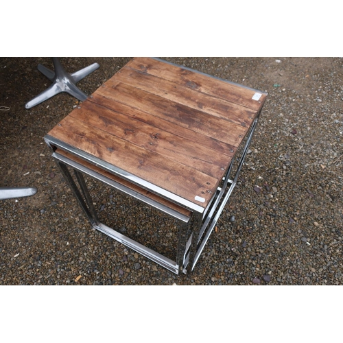 120 - Nest of three chrome framed and wooden plank top occasional tables