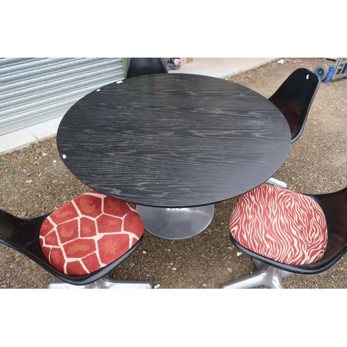 121 - Arkana design circular top table and a set of four chairs Reg No 900156 Pat No 983617