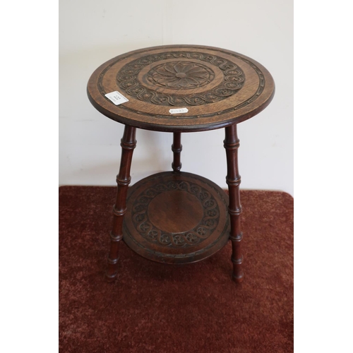 122 - Early 20th C carved mahogany two tier circular occasional table on three faux bamboo supports