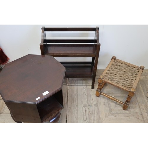 131 - Mahogany revolving occasional table, a small two tier open bookcase and a string top stool (3)