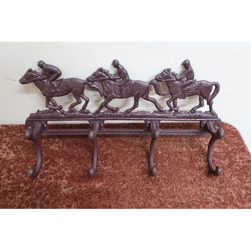 14 - Cast metal four hook wall mounted hat and coat rack decorated with racing horses (width 40cm)